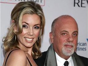 FILE - In this Oct. 15, 2013 file photo, Alexis Roderick, left, and Billy Joel arrive at the Elton John AIDS Foundation's 12th Annual "An Enduring Vision" benefit gala in New York. Joel married girlfriend Alexis Roderick in a surprise ceremony at the couple’s annual July 4 party. The singer’s spokeswoman Claire Mercuri says New York Gov. Andre Cuomo presided over Saturday’s nuptials at Joel’s Long Island estate. (Photo by Carlo Allegri/Invision/AP, File)
