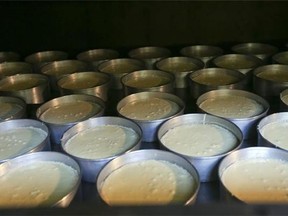 In this Thursday, July 16, 2015 photo, cheesecakes bake in an oven at New Skete Kitchens in Cambridge, N.Y. The nuns of New Skete lead a cloistered life marked by prayer, contemplation and baking cheesecakes, lot’s of cheesecake. The small group of fiercely self-reliant nuns in upstate New York have long sold cheesecakes online, continuing a centuries-old tradition of monastic orders producing fine foods to pay expenses. (AP Photo/Mike Groll)