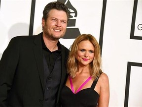 Blake Shelton, left, and Miranda Lambert arrive at the 57th annual Grammy Awards in Los Angeles. Shelton and Lambert announced their divorce after four years of marriage. Shelton’s spokesman provided a statement from the couple on Monday, July 20, 2015. (Photo by Jordan Strauss/Invision/AP, File)