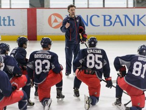 Harrow's Lee Harris, centre, talks to top prospects of the Columbus Blue Jackets during the team's development camp in Columbus last week. (Courtesy of Jamie Sabau)