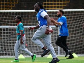 Joique Bell of the Detroit Lions helps to coach a team of local school children during the NFL Launch of the Play 60 scheme at the Black Prince Community Hub on July 15, 2015 in London, England.  (Photo by Dan Mullan/Getty Images)