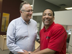 The new NBL of Canada commissioner, David Magley, is greeted by new Windsor Express head coach, Tony Jones, Wednesday, July 15, 2015. (DAX MELMER/The Windsor Star)