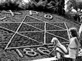 The Expo 67 theme of Jackson Park’s flower bed is admired on July 25, 1966, by Christine Levenick, 4, left, Marjorie Levenick, 6, Kathy Salick, 6, and Matthew Salick, 8.(Windsor Star files)