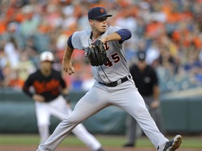 Detroit Tigers starting pitcher Buck Farmer throws to the Baltimore Orioles in the first inning of a baseball game, Friday, July 31, 2015, in Baltimore. (AP Photo/Patrick Semansky)