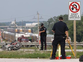 Windsor police officers on the scene of a fatal collision on E.C. Row on July 29, 2015. (Dan Janisse/The Windsor Star)