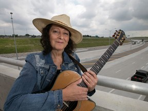 Martha Renaud, a local singer/songwriter, is pictured next to the Herb Grey Parkway, Wednesday, July 1, 2015. Renaud wrote three songs about the Parkway. (DAX MELMER/The Windsor Star)
