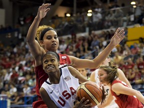 Windsor's Miah-Marie Langlois, left, battles for the ball against United States guard Moriah Jefferson, right, during first half gold medal action at the Pan American Games in Toronto on Monday, July 20, 2015. THE CANADIAN PRESS/Nathan Denette