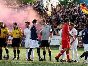 Northern Guard were already in high gear as Detroit City FC hosts a 'friendly' soccer game against Windsor Stars, Wednesday July 22, 2015.  Windsor Stars players shake hands with Detroit City FC before the match at Cass Tech. (NICK BRANCACCIO/The Windsor Star)