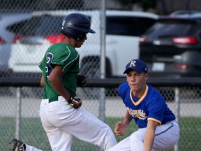 Windsor Stars Minors Stanley Dean, left, gets back to the bag as Riverside Bantam Minors Caden Lear takes the throw in the third inning at Soulliere Field Thursday July 23, 2015.  (NICK BRANCACCIO/The Windsor Star)