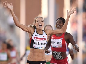 Former Lancer Melissa Bishop, left, places first to win gold ahead of Alysia Montano (R) of the US who won silver in the women's 800-meter Final  during the 2015 Pan American Games in in Toronto, Canada on July 22, 2015.      AFP PHOTO /  Jim WATSONJIM WATSON/AFP/Getty Images