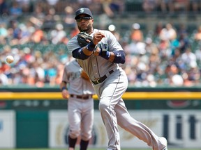 DETROIT, MI - JULY 23: Robinson Cano #22 of the Seattle Mariners makes a play to first base during a MLB game against the Detroit Tigers at Comerica Park on July 23, 2015 in Detroit, Michigan.(Photo by Dave Reginek/Getty Images)