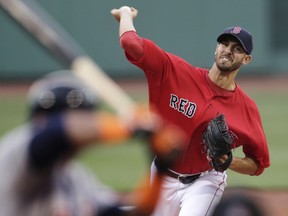 Boston Red Sox starting pitcher Rick Porcello delivers to the Detroit Tigers during the first inning of a baseball game at Fenway Park on Friday, July 24, 2015, in Boston. (AP Photo/Charles Krupa)