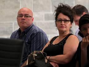 LaSalle resident Mike Magri, left, and Lilly Magri wait at LaSalle Council meeting Tuesday July 28, 2015.  Several LaSalle residents were hoping to speak to council regarding recent flooding, causing damage to their homes. The Magri family have dealt with flooding on two occasions. (NICK BRANCACCIO/The Windsor Star)