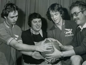 Herman coach Chris McCaffery, second from left, poses for a photo with Mike Kvolek, from left, Brian Marshall and Bud Leonard in 1977. (Windsor Star files)