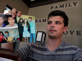 C. J. Bernauer, brother of Emily Bernauer, who was killed in a single vehicle collision last year which untimately led to the cancellation of an Amherstburg's Shores of Erie Wine Festival, has spoken out against "unfair" and "incorrect" comments posted about his sister and the incident.  C.J. holds treasured family snapshots showing Emily Thursday July 30, 2015.  (NICK BRANCACCIO/The Windsor Star)