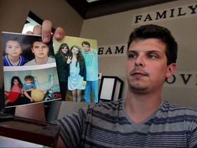 C. J. Bernauer, brother of Emily Bernauer, who was killed in a single vehicle collision last year which untimately led to the cancellation of an Amherstburg's Shores of Erie Wine Festival, has spoken out against "unfair" and "incorrect" comments posted about his sister and the incident.  C.J. holds treasured family snapshots showing Emily Thursday July 30, 2015.