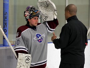 Goalie Erica Fryer receives some encouragement from coach Perry Wilson at Libro Centre Monday June 22, 2015.  Fryer has been selected to play for West Coast Selects in a World Selects Championship in Italy in August.  (NICK BRANCACCIO/The Windsor Star).