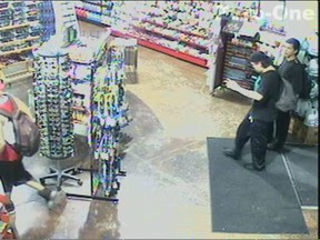 Two suspects who were allegedly involved in the assault of a 17-year-old male victim at the Q-Store in the 3900 block of Dougall Avenue are pictured in this surveillance photo. (Courtesy of Windsor police)