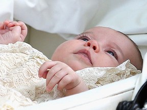 Princess Charlotte of Cambridge in her silver cross pram, leaves her Christening at St. Mary Magdalene Church in Sandringham, England, on July 5, 2015. Britain's baby Princess Charlotte was christened on Sunday in her second public outing since her birth nine weeks ago to proud parents Prince William and his wife Kate. The low-key ceremony took place in a church on the country estate of great grandmother Queen Elizabeth II. (Chris Jackson/AFP/Getty Images)