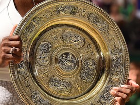 U.S. player Serena Williams celebrates with the winner's trophy, the Venus Rosewater Dish, after her women's singles final victory over Spain's Garbine Muguruza on day twelve of the 2015 Wimbledon Championships at The All England Tennis Club in Wimbledon, southwest London, on July 11, 2015. Williams won 6-4, 6-4.  --  AFP PHOTO / LEON NEALLEON NEAL/AFP/Getty Images
