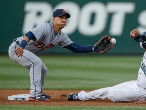 Former Tiger Austin Jackson, right, steals second base against shortstop Jose Iglesias during the Tigers' 12-5 win over the Mariners at Safeco Field Monday in Seattle, Washington.  (Photo by Otto Greule Jr/Getty Images)