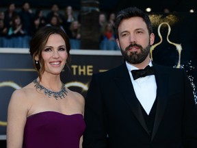 Actor/director Ben Affleck and wife actress Jennifer Garner arrive on the red carpet for the 85th Annual Academy Awards on February 24, 2013 in Hollywood, California.