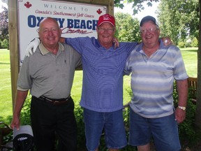 Ron Dotzenroth, centre, used a nine-iron to ace the 85-yard ninth hole at Oxley Beach. Witnesses were Gerry Giles, left, and Bruce Lefaive.