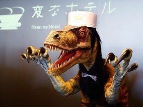 A receptionist dinosaur robot performs at a new hotel, aptly called Henn na Hotel or Weird Hotel, in Sasebo, southwestern Japan, Wednesday, July 15, 2015. From the receptionist that does the check-in and check-out to the porter that’s a stand-on-wheels taking luggage up to the room, the hotel, that is run as part of Huis Ten Bosch amusement park, is “manned” almost totally by robots to save labor costs. (AP /Shizuo Kambayashi)