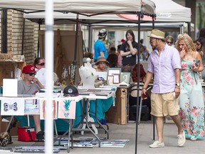 Vendors display their art at the Alley Art Show and Sale on Maiden Lane, Saturday, July 18, 2015.  (DAX MELMER/The Windsor Star)