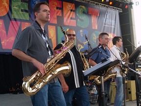 The Groove Council's horn section: Dave Snyder (left), Brandon Cooper (centre) and Len Temelini play at Bluesfest on July 11, 2015. (ALEX BROCKMAN/The Windsor Star)