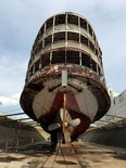 In a Monday, June 8, 2015 photo, the stern and very large propeller of the SS Columbia, also known as one of the two Boblo boats, can be seen as it sits in dry dock at a shipyard in Toledo, Ohio. The ship that ferried thousands and thousands to the famous island amusement park for many decades until its closing in 1993 was bought and is undergoing extensive renovations. The hull has been painted and the Columbia is scheduled to be taken to Buffalo in August. (Eric Seals/Detroit Free Press via AP)