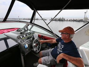 Paul Brown, 81, cruises near the Leamington Harbour outer breakwall on Wednesday, July 8, 2015. The town of Leamington has hired a consultant to assess the breakwall.  (DAN JANISSE/The Windsor Star)