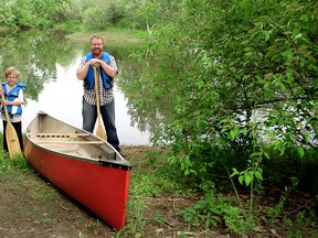 Trevor Thompson, left, and his son Ian, 7, will begin a multi-day canoe trip on July 16 from Delaware, just west of London, to Thamesgrove Conservation area in Chatham, Ont. Wednesday July 8, 2015. (Diana Martin/Postmedia News)