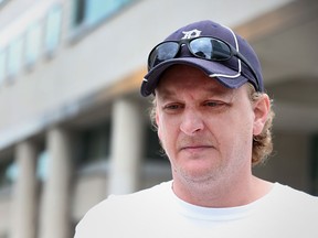 Jeff Durham pauses while talking with the media about the murder of Cassandra Kaake and her unborn child.  Durham and others staged a protest outside the Provinical Court of Justice  in Windsor, Ontario on July 8, 2015. (JASON KRYK/The Windsor Star)