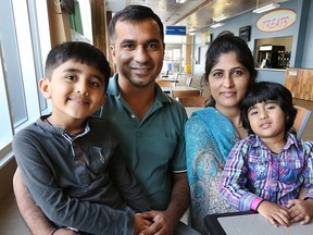 Haresh Kumar Oad, his wife Kaweeta Oad, son Sudhish Kumar Oad, 5 and daughter Divya Oad, 3, pose for a photo on Monday, July 20, 2015 at the Adventure Bay Family Water Park in Windsor, ON. The father was commenting on the universal child care benefit payments announced recently by the federal government. (DAN JANISSE/The Windsor Star)