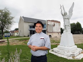 Father Christian Campos of St. Michael Catholic Church in Leamington, ON. poses in front of the parish property where the former church was demolished and a new facility will be built. (DAN JANISSE/The Windsor Star)