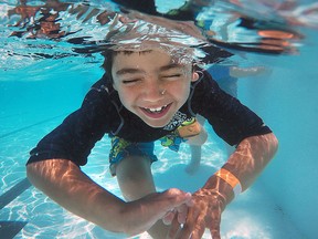 Julian Gonzalez, 6, cools down at the Atkinson Park pool on Monday, July 27, 2015, in Windsor, Ont. It was an especially hot week as temperatures climbed to above 30C.