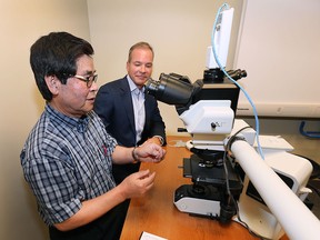 A room at the Windsor Regional Hospital Met Campus was dedicated in honour of Caesars Windsor on Thursday, July 2, 2015, for a $130,000 donation to the institution. The money will help fund the purchase of high performance laboratory and diagnostic equipment. Dr. Paul Ra (L) of the WRH displays some of the equipment to Caesars Windsor President and CEO Kevin Laforet during the ceremony. (DAN JANISSE/The Windsor Star)