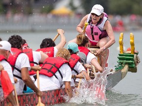 ackie Gomes leads her dragon boat team, the First Training Broads at the International Dragon Boat Festival for the Cure at Tecumseh Waterfront Park, Sunday, July 19, 2015.  (DAX MELMER/The Windsor Star)