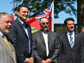 Ted McMeekin, Minister of Municipal Affairs and Housing, from left, Essex MP Jeff Watson, Pelee Mayor Rick Masse and Amherstburg Mayor Aldo DiCarlo on Wednesday, July 15, 2015, at the King’s Navy Yard Park in Amherstburg. The provincial and federal governments are contributing more than $6 million for infrastructure projects in Amherstburg and on Pelee Island. JULIE KOTSIS/The Windsor Star