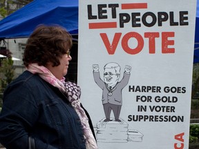 In this file photo, NDP MP Libby Davies attends a small rally held in opposition of the Fair Elections Act in Vancouver, B.C., on Saturday, April 26, 2014. THE CANADIAN PRESS/Darryl Dyck