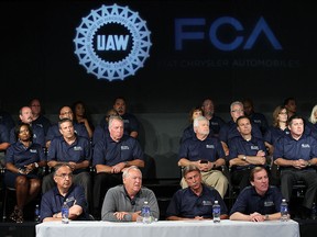 Sergio Marchionne, chairman and DEO, FCA US, (left) and Dennis Williams, president UAW, take part in a joint press conference to kick off the UAW-FCA labour talks at the UAW-Chrysler National Training Centre in Detroit on Tuesday, July 13, 2015.                         (TYLER BROWNBRIDGE/The Windsor Sta