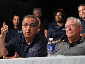 Sergio Marchionne, chairman and DEO, FCA US, (left) and Dennis Williams, president UAW, take part in a joint press conference to kick off the UAW-FCA labour talks at the UAW-Chrysler National Training Centre in Detroit on Tuesday, July 13, 2015.                         (TYLER BROWNBRIDGE/The Windsor Star)