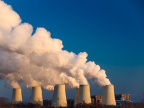 Smoking pipes of thermal power plant on sunset. Photo by fotolia.com