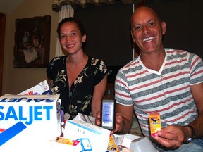 Deanna Owen, left, and Kim Schroeder pose with some medical supplies to be donated on their medical mission trip to Haiti in October. (ALEX BROCKMAN/The Windsor Star)