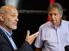 Chatham-Kent Essex MP Dave Van Kesteren, left, and Hike Metal Products president Andy Stanton are shown during a news conference on Thursday, July 9, 2015, at the Wheatley, ON. business. The company received a $43.4  million dollar contract from the federal government to build lifeboats for the Canadian Coast Guard. (DAN JANISSE/The Windsor Star)