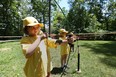 Saoirse Ross, age 6, takes part in an archery event at Camp Cedarwin in Harrow, Ontario on July 20, 2015.  Twenty-one children from Hospice who have a parent, grandparent or sibling with a diagnosis took part in the  camp day hosted by Scouts Canada.   The event featured  Canoeing,  archery, climbing, and a trip to Adventure Bay water park.   (JASON KRYK/The Windsor Star)