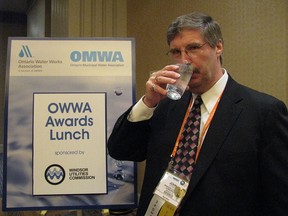 In this file photo, John Stuart, vice-president of EnWin Utilities takes a sip of water competing in the 2010 best tasting drinking water contest.