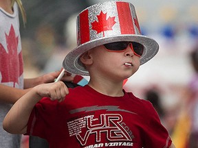 Dominick Barry, 4, cheers on the participants of the Canada Day Parade as it made it's way down Wyandotte St. East, Wednesday, July 1, 2015.  (DAX MELMER/The Windsor Star)
