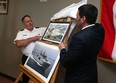 Lt.-Cmdr. Robert Head and MP Jeff Watson (right) reveal the name of HMCS Frederick Rolette which will be attached to a soon to be built Arcitc/Offshore Patrol Ship at the HMCS Hunter in Windsor on Thursday, July 16, 2015.                         (TYLER BROWNBRIDGE/The Windsor Star)